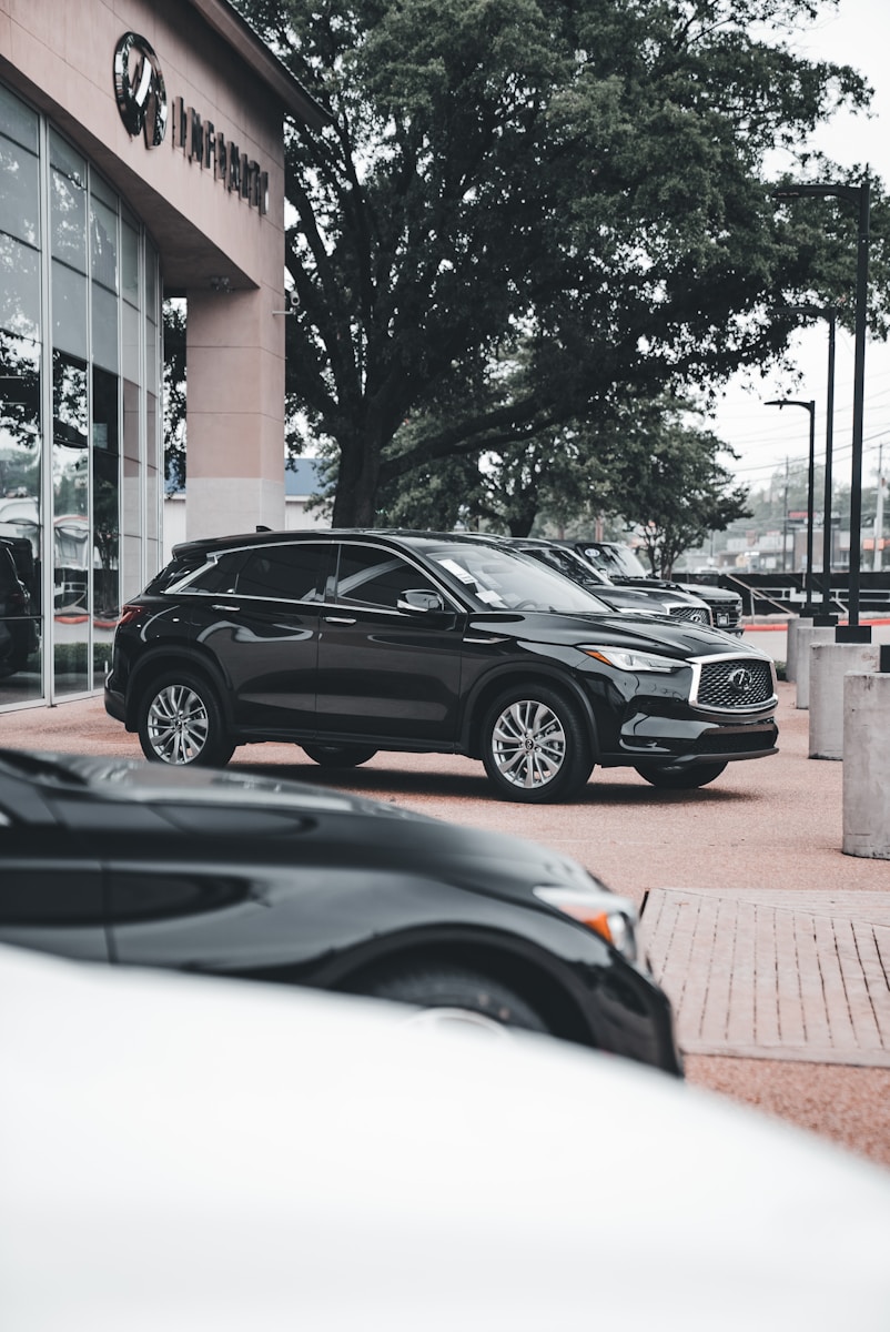 a couple of cars parked in front of a building